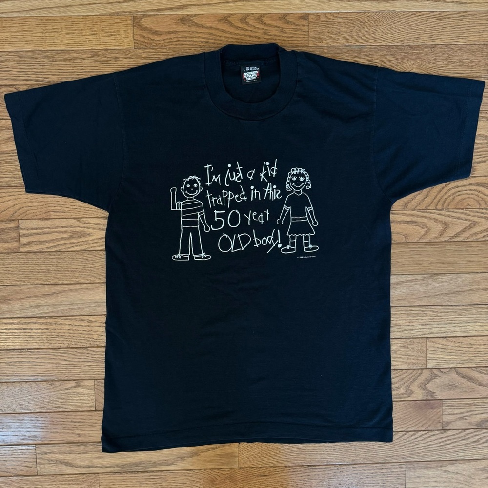 “I’m just a kid trapped in this 50 year old body!”Graphic T-Shirt